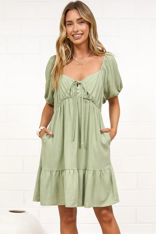 Michi mini dress in sage green with puff sleeves and tie neckline