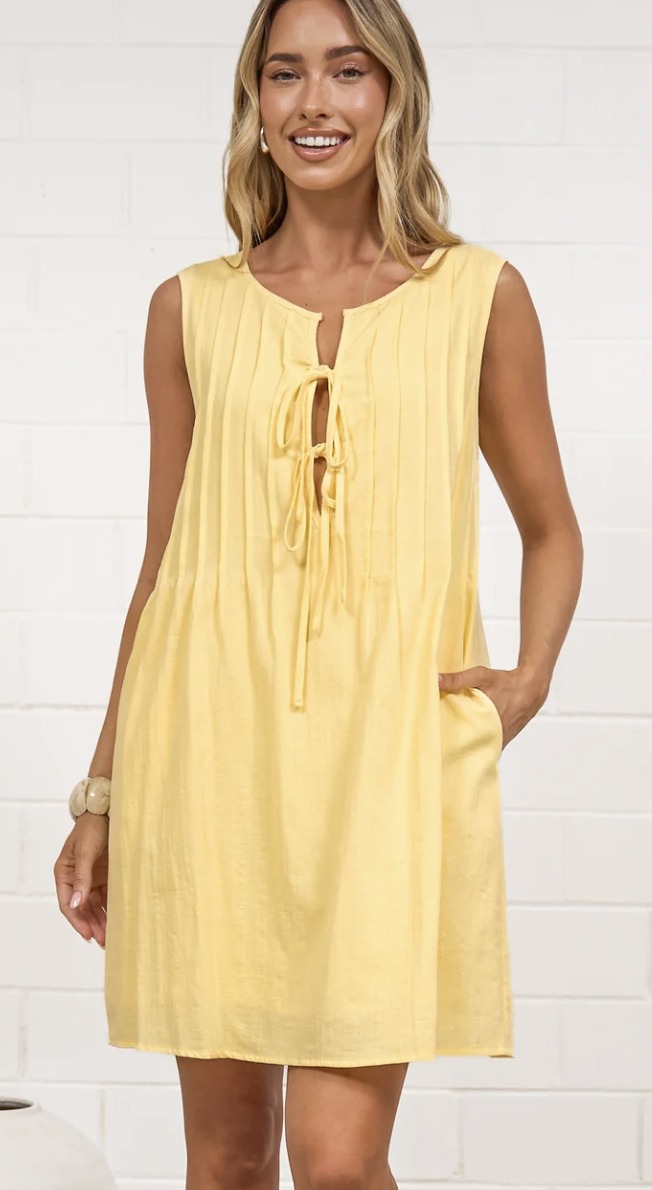 Della mini dress in butter yellow with tie-up bodice and pintuck pleats